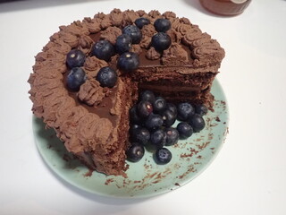 sweet decorated chocolate cake with blueberries