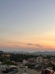 Pink Sunset Over a Greek Mountain Cityscape