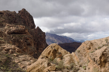 Fototapeta premium Gran Canaria, landscape of the central part of the island, Las Cumbres, ie The Summits, short hike between rock Formation Chimirique and iconic Roque Nublo
