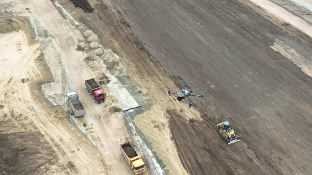 Aerial view of a drone flying over a construction site. 