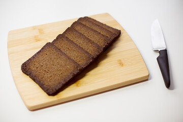  Freshly Sliced Rye Bread on a Wooden Cutting Board