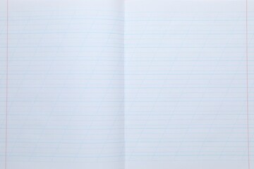 Open copybook as background, top view. School stationery