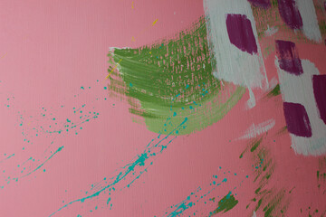Color splashes on a pink wall texture and abstraction for interior and banner