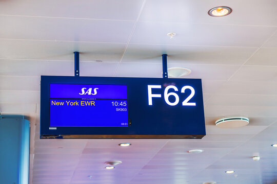 Gate sign F62 for SAS flight SK903 departing at 10:45 to New York EWR (Newark Liberty International Airport). Stockholm, Sweden.