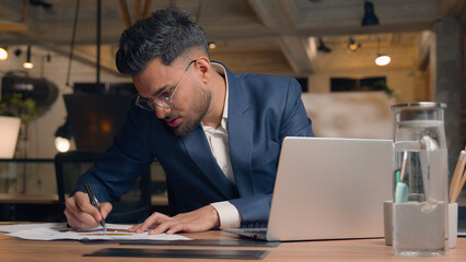 Indian businessman male ethnic entrepreneur leader corporate manager agent work computer laptop...