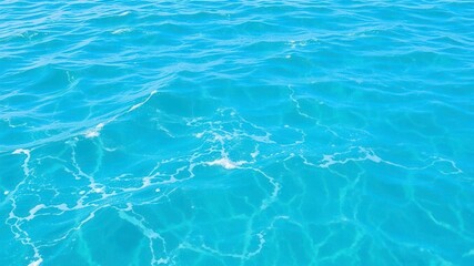 Obraz premium Pure blue turquoise water with foamy waves, perfect for tropical paradise designs and sea backgrounds, aquatic, relaxation, tranquil