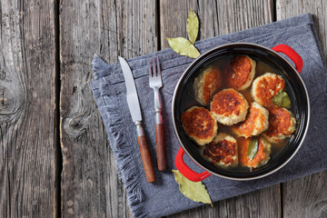 turkey potato cakes in a red pot, top view