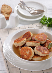 turkey potato cakes in white bowl, top view