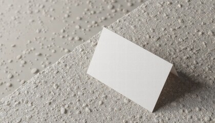 A Business Card Mockup Displayed On A Textured Background