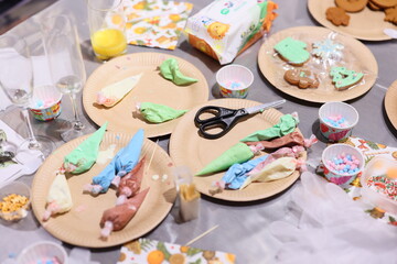 A Vibrantly Colorful Dessert Decorating Table Complete with Icing and Sweet Treats Galore