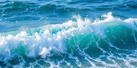 A powerful ocean wave crashing onto the shore, creating a foamy white spray, motion, rippling