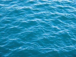 Obraz premium Blue water wave texture background with soothing ripples and oceanic hues, water, wet