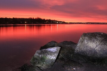 sunrise over calm water - Lysaker