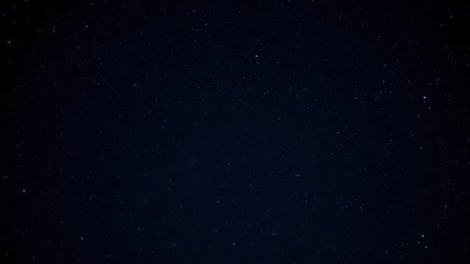 Dark night sky filled with sparkling stars against a black background, nightfall, nighttime