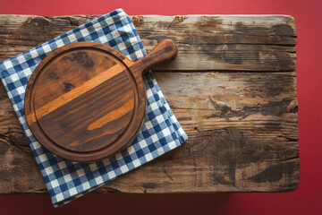 Rustic Wooden Table with Checkered Cloth and Cutting Board Highlight
