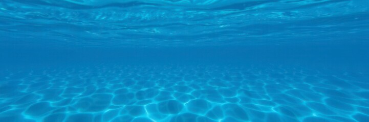 Fototapeta premium Rippling deep blue sea texture resembling a mesmerizing wave pattern, sea foam, ocean