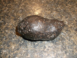 Meteorite on table.