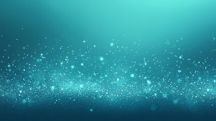 Turquoise glitter particles with soft glowing bokeh