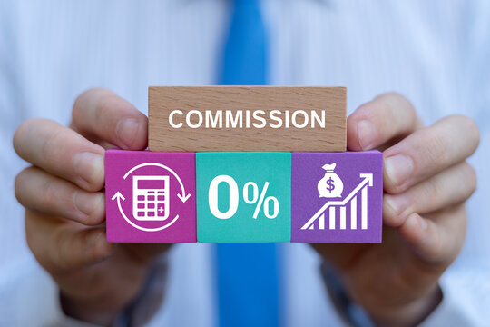 Person holding colorful blocks sees word: COMMISSION. Commission payment, interest rate for loan payment or investment profit percentage, incentive to reward or motivate concept.