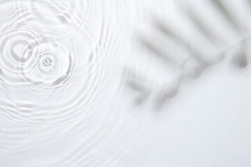 Obraz premium Rippled surface of clear water on white background, top view