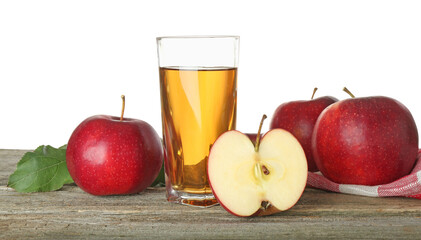 Tasty apple juice in glass and fresh fruits on wooden table against white background