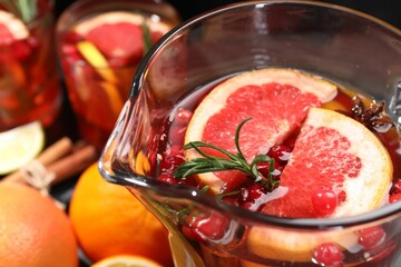 Delicious punch with rosemary in jug, closeup
