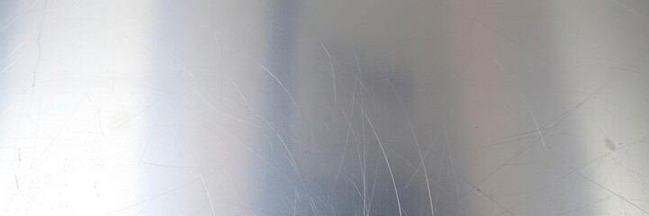Obraz premium Close up shot of a shiny metal surface with a textured pattern, perfect for use as a background, surface, detail