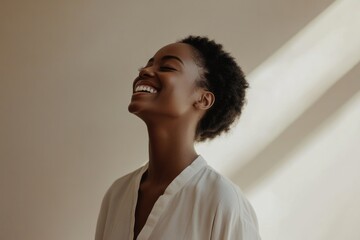 Joyful moment captured in soft light highlighting a woman\'s radiant smile and carefree spirit in a serene indoor setting