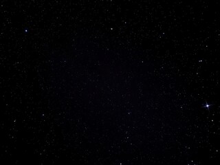 Fototapeta premium Night sky filled with sparkling stars against a black background, astrophotography, astronomy, peaceful