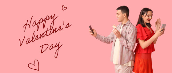 Young couple with mobile phones and engagement ring on pink background. Online dating