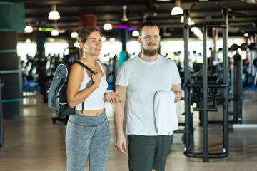 Training has ended in gym, visitors leave gym, leave workplace. Visitors of sports club come out after training