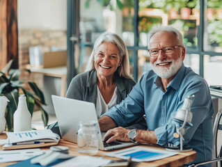 Elderly man and woman discuss estate planning in a modern home office, with financial documents and a laptop. Natural light and a warm setting.