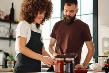 Chefs preparing ingredients for a recipe in a modern kitchen