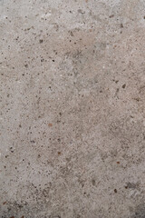 Industrial gray wall texture featuring irregular spots and subtle cracks