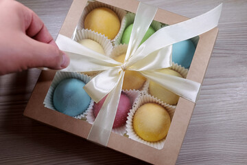 A Beautifully Wrapped Gift Box Containing Vibrant, Colorful Sweets, Adorned With A Delicate White Ribbon. Perfect For Celebrations, Special Occasions, Or Simply As A Sweet Surprise For Loved Ones.