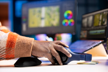 Video maker producing footage with artistic editing software, doing color adjustment and special...