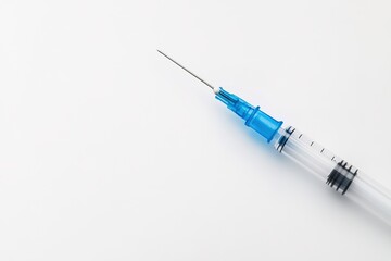 Fototapeta premium Minimalist syringe on white backdrop, healthcare concept