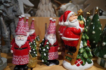 Christmas decoration objects in the shop, santa claus figurines