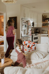 Mother and Child in Cozy Modern Kitchen, Playful Family Moment with Home Interior Details