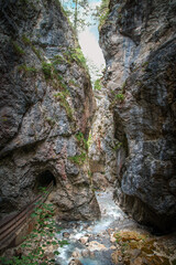 Through-the-gorge view of dramatic rocky narrow Rosengarten hiking trail, Austria