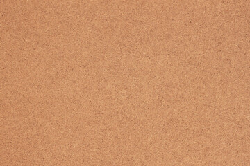 Corkboard texture in warm natural brown tones. Concept of eco-friendly material, neutral background