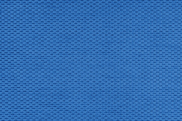 Plain blue jacquard upholstery fabric, satin material with woven structure, pattern texture background. Close up, macro cloth textile surface. Wallpaper, backdrop with copy space