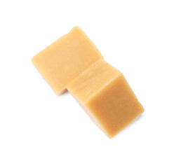 Tasty sweet caramel candies isolated on white, top view
