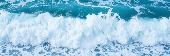 Fototapeta premium Powerful ocean wave crashing on rocky shore, creating a cascade of frothy white foam, motion, majestic, violent