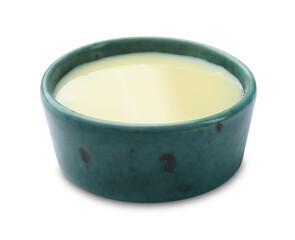 Condensed milk in bowl isolated on white