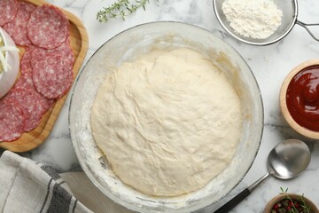 Making calzone pizza. Different ingredients on white marble table, flat lay
