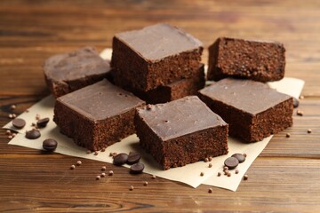 Delicious chocolate puffed rice bars on wooden table, closeup