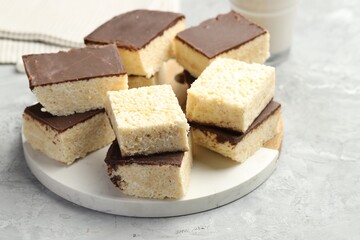 Delicious puffed rice bars on gray textured table, closeup