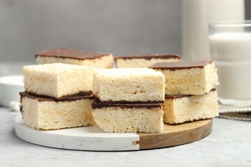 Delicious puffed rice bars on gray textured table, closeup