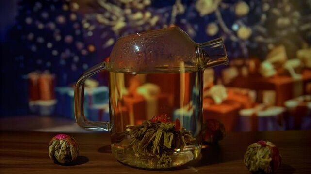 Brewing traditional Chinese blossom tea in Christmass decorated room